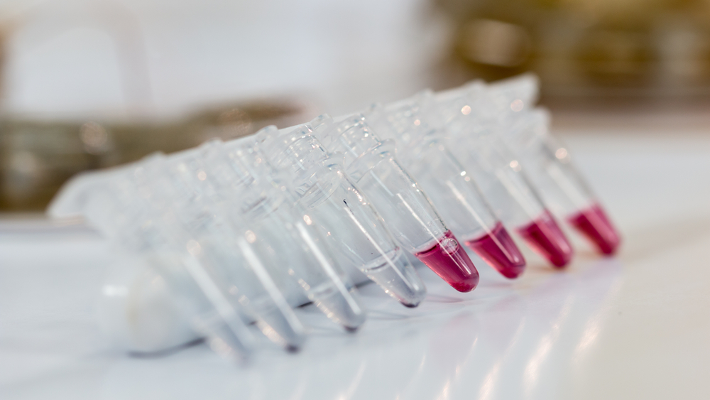 Microcentrifuge Tubes on lab bench with red substance