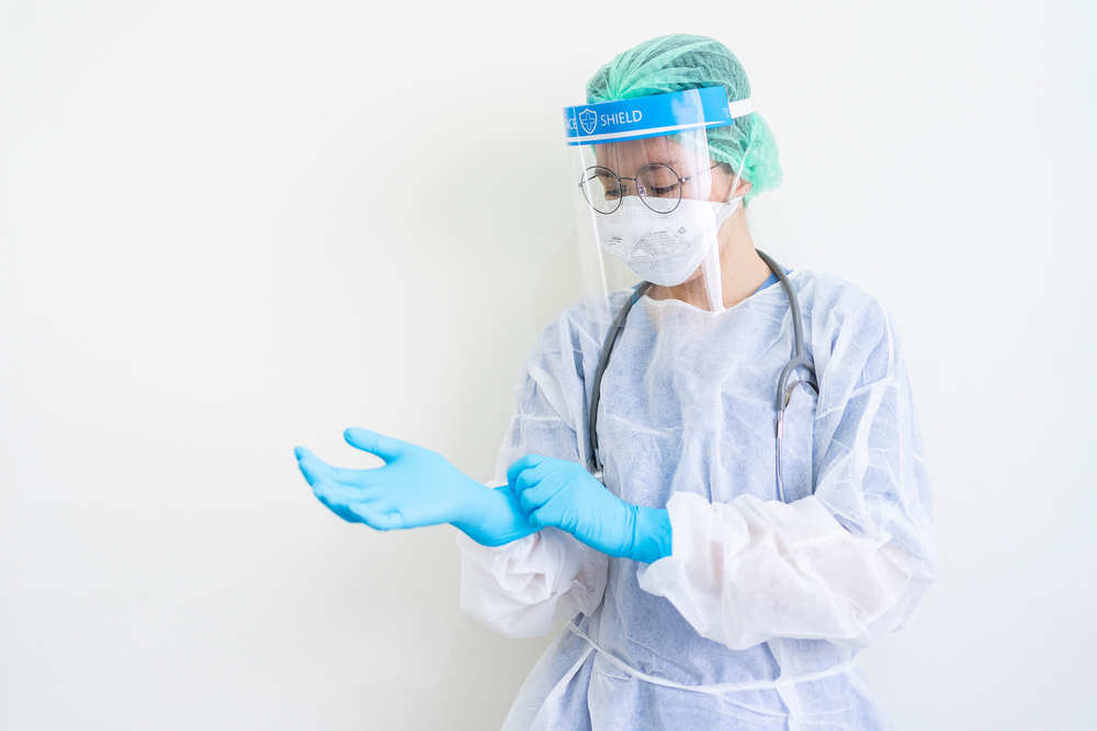 worker wearing protection Suit for Fighting Covid-19 (Corona virus) with white background